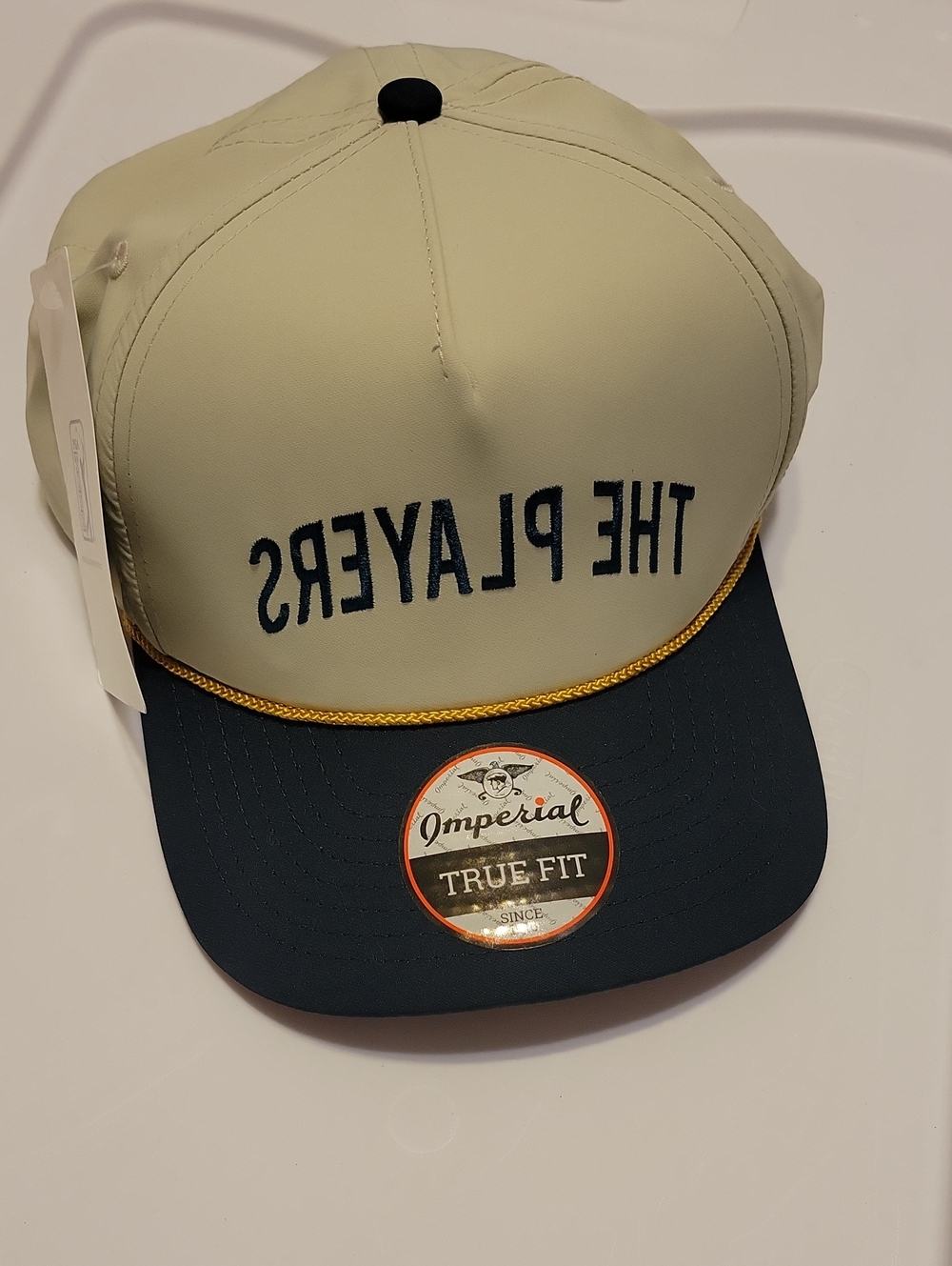 PGA Tour THE PLAYERS Two-Tone Cap in Cream & Navy with Gold Rope - Reverse Logo